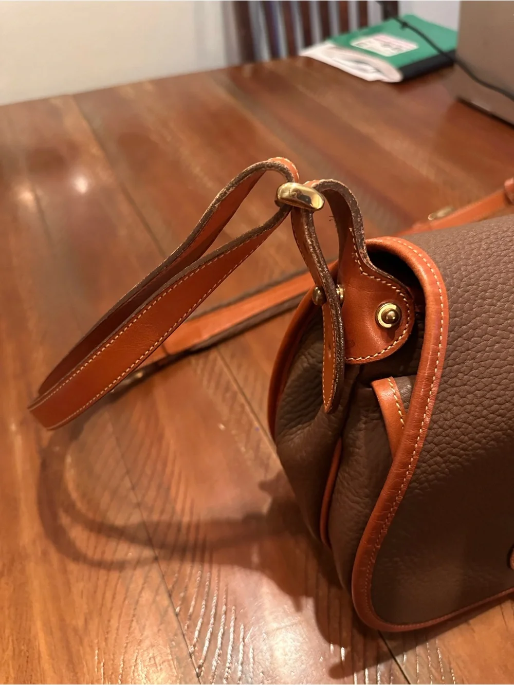 Dooney & Bourke Brown Pebbled Leather Horseshoe Crossbody with Tan Trim